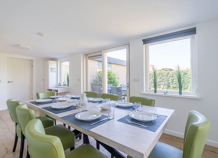 Bright living room in Orchismient 14 vacation home, De Koog Texel with comfortable seating area.