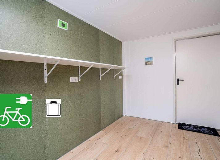 Bright living room in Orchismient 14 vacation home, De Koog Texel with comfortable seating area.