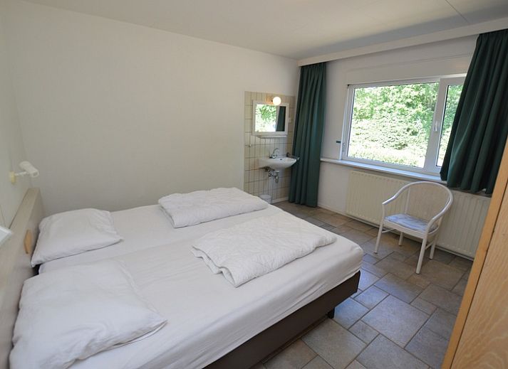 Gemuetliche Sitzecke mit Kamin im Ferienhaus Epelaan 31, De Koog, Texel, ideal fuer einen gemuetlichen Abend.