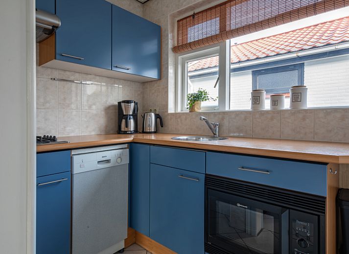 Gezellige woonkamer van Riddertje vakantiehuis in De Koog, Texel. Perfect voor een ontspannen verblijf op de Waddeneilanden.