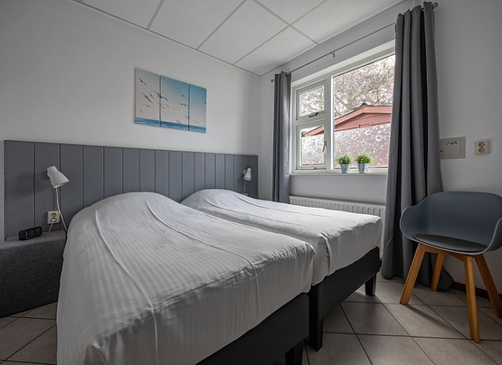 Gezellige woonkamer van Riddertje vakantiehuis in De Koog, Texel. Perfect voor een ontspannen verblijf op de Waddeneilanden.