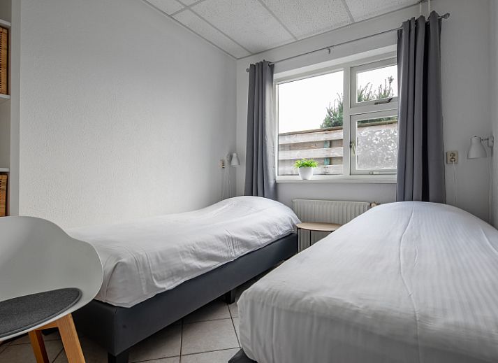 Gezellige woonkamer van Riddertje vakantiehuis in De Koog, Texel. Perfect voor een ontspannen verblijf op de Waddeneilanden.