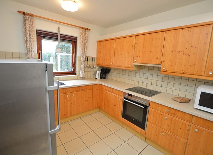 Gezellige woonkamer in Orchismient 35, De Koog, Texel, met comfortabele zitplaatsen.