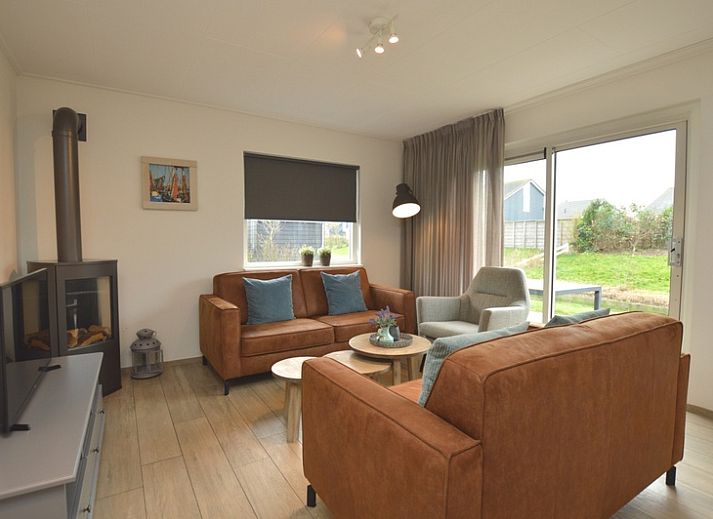 Ferienhaus Stappeland 215 in De Koog, Texel, mit grosser Terrasse und Garten, ideal fuer Entspannung auf den Watteninseln.