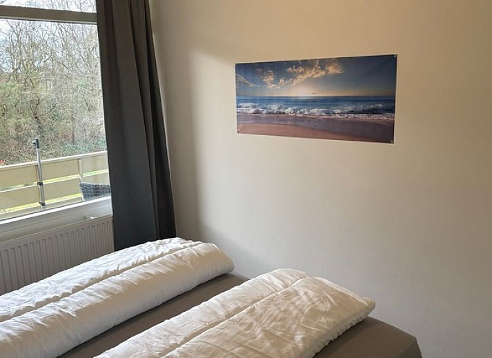 Gemuetliche Sitzecke im Apartment Kerckeland 40, De Koog, Texel mit grossen Fenstern und Aussicht.