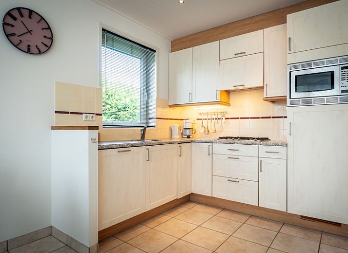 Vacation home Bungalow 31 in De Koog, Texel with sunny terrace and green surroundings.