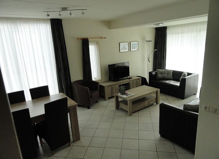 Vakantiehuis Koogerduin in De Koog, Texel, met charmante bakstenen gevel en uitnodigende veranda.