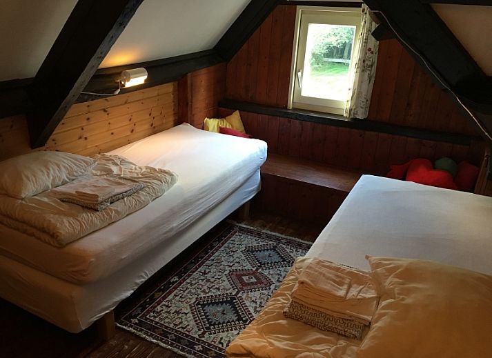 Charmant vakantiehuis Achterhuis in De Koog op Texel, omgeven door bloeiende tuin.