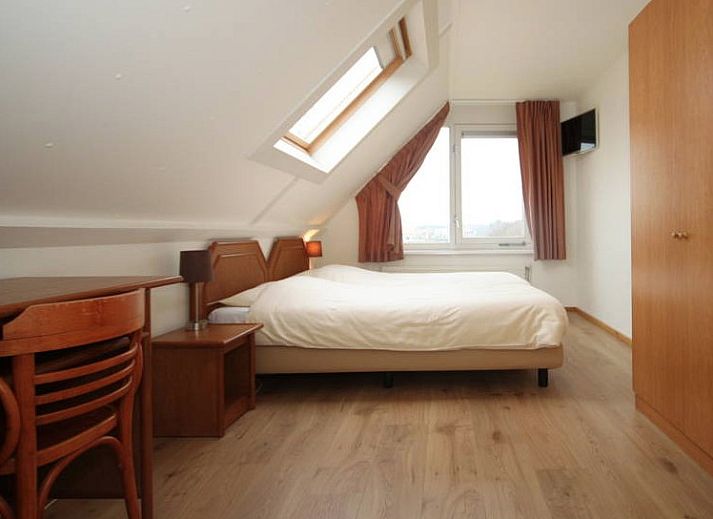 Comfortabele woonkamer van 6 Persoons luxe villa met sauna in De Koog, Texel, met moderne inrichting.