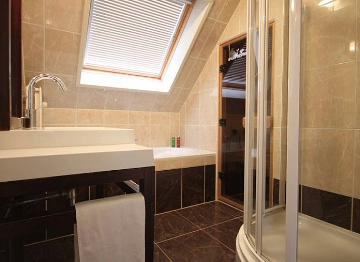 Comfortabele woonkamer van 6 Persoons luxe villa met sauna in De Koog, Texel, met moderne inrichting.