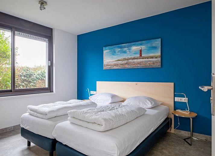 Orchismient 20, De Koog vakantiehuis met moderne gevel en groene tuin op Texel, Waddeneilanden.