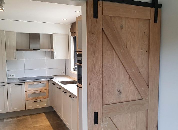 Luchtfoto van Orchismient 20, De Koog, vakantiehuis met ruime tuin op Texel, Waddeneilanden.