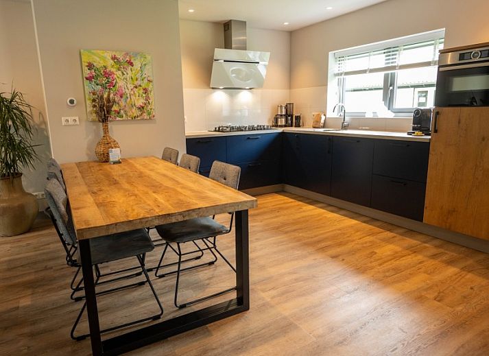 Landgoed Springtij Stulpje Ferienhaus in De Koog Texel mit schoener Fassade und gruener Umgebung.