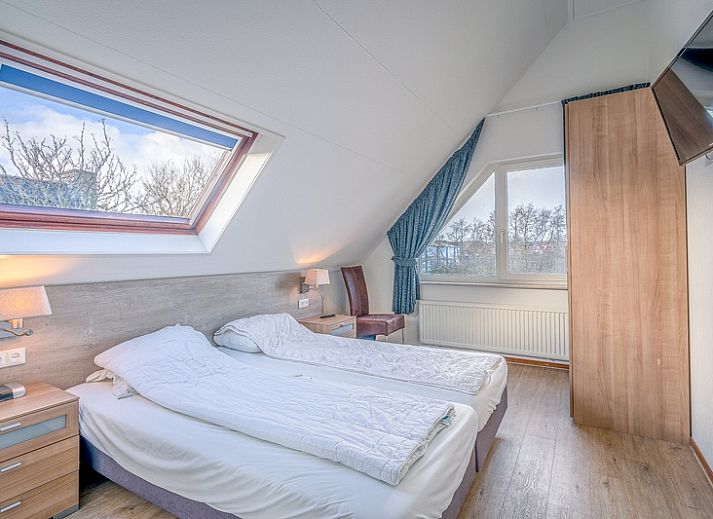 Gezellige woonkamer van Vakantiehuis Kamperfoelie 51 in De Koog, Texel met comfortabele zithoek.