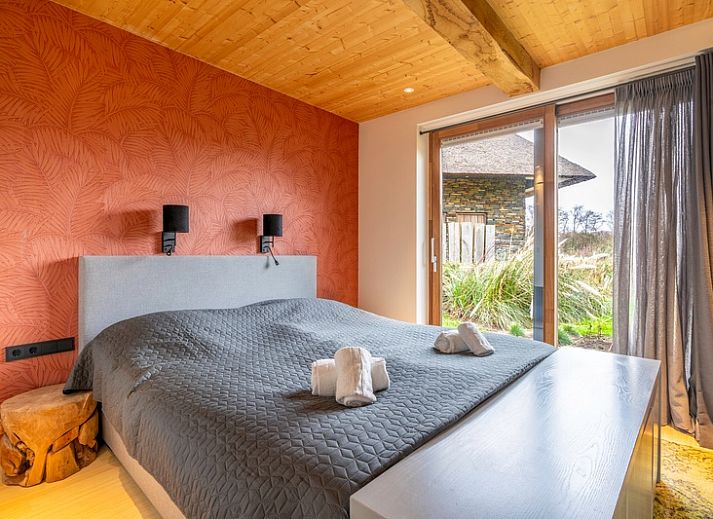 Vacation home Villa 191 with Hot tub in De Koog, Texel, offers a beautiful terrace with comfortable seating.