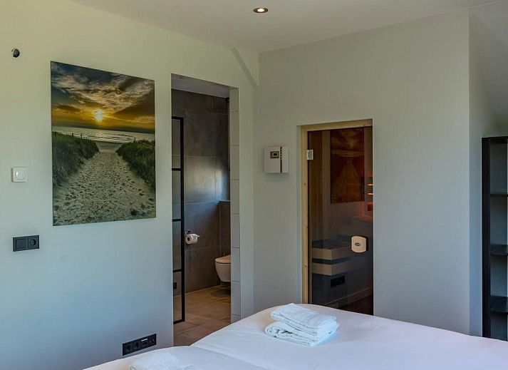 Geniet van de zon in de tuin van vakantiehuis Grutto 16 in De Koog, Texel. Perfecte plek voor ontspanning op de Waddeneilanden.