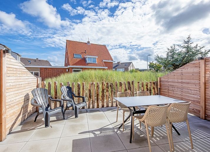 Gezellige woonkamer in De Duinroos vakantiehuis, De Koog, Texel met comfortabele zitruimte.
