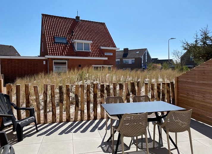 Gezellige woonkamer in De Duinroos vakantiehuis, De Koog, Texel met comfortabele zitruimte.