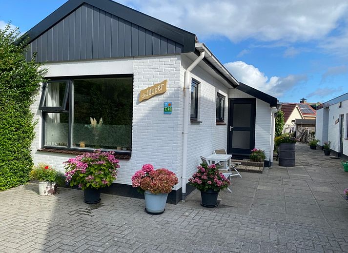 Gemuetliches Wohnzimmer im Ferienhaus Jutter, De Koog, Texel mit Blick auf die Natur.