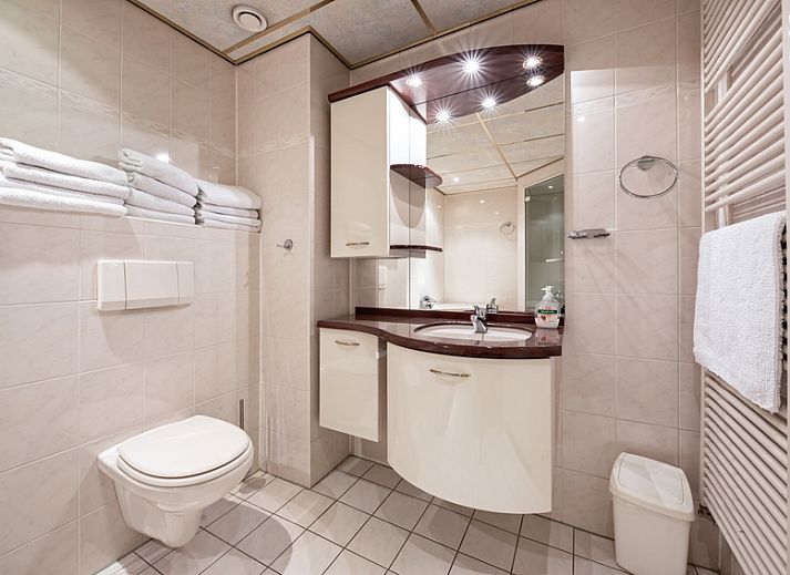 Gezellige woonkamer in Resort De Buteriggel - Appartement 1 met uitzicht op zee in De Koog, Texel.