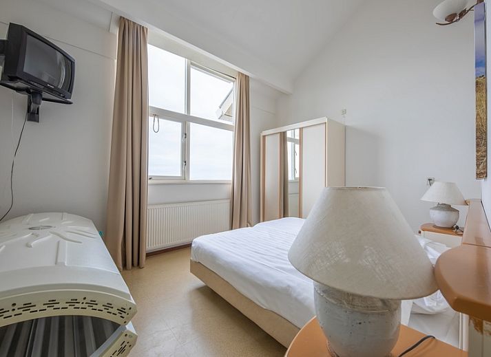 Open keuken en zithoek in Resort De Buteriggel - Appartement 1, ideaal voor een comfortabel verblijf in De Koog, Texel.