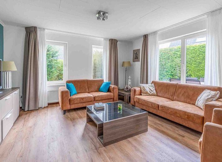 Cozy terrace at Holiday home Honeysuckle 49 in De Koog Texel, perfect for outdoor activities on the Wadden Islands.