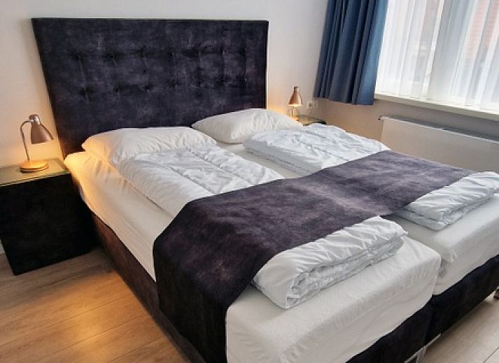 Gezellige eetruimte in Vakantiehuis Duinzee Texel, De Koog, met stijlvolle inrichting en natuurlijk licht.