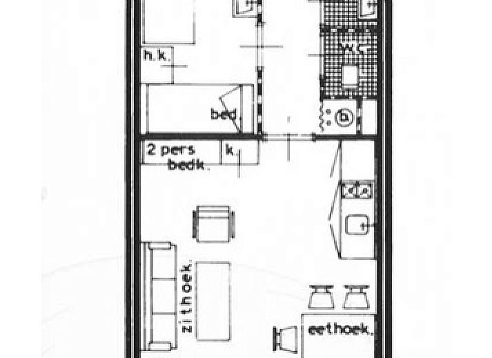 Stijlvolle zithoek in Motel Texel Appartement (Y), De Koog, Texel met comfortabele bank en decoratieve kussens.