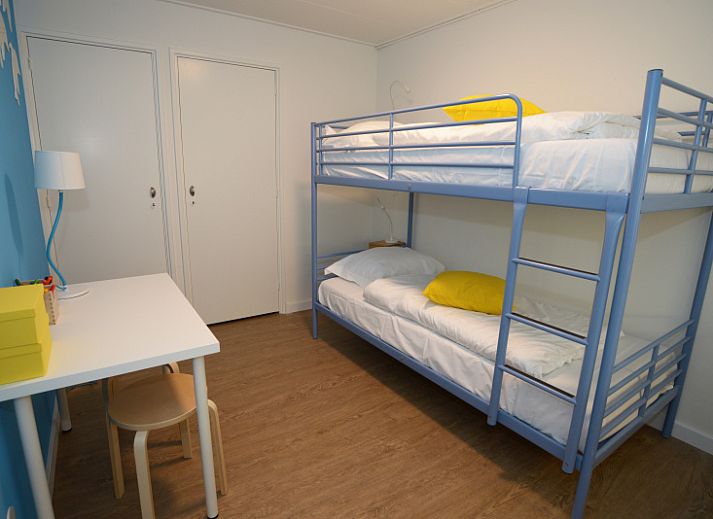 Gezellige woonkamer in Grand Hotel Opduin - Vakantiewoning B, De Koog, Texel met uitzicht op de natuur.