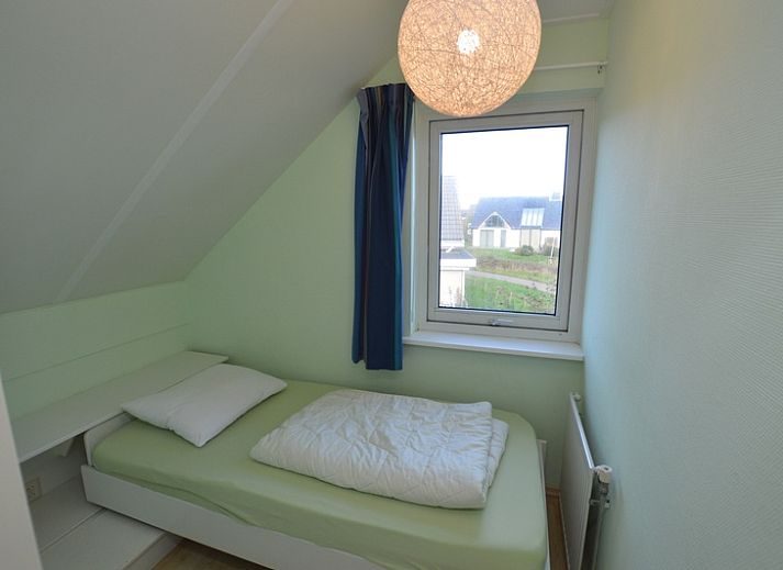 Gezellige woonkamer van Vakantiehuis Stappeland 199 in De Koog, Texel met leren banken.