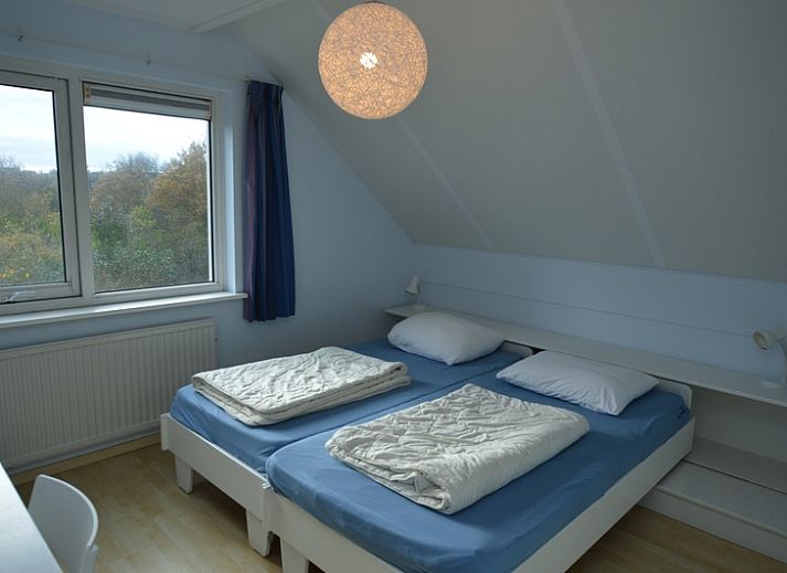 Gezellige woonkamer van Vakantiehuis Stappeland 199 in De Koog, Texel met leren banken.