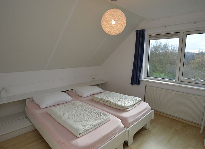 Comfortabele zithoek in Vakantiehuis Stappeland 199, De Koog, Texel met uitzicht op de tuin.