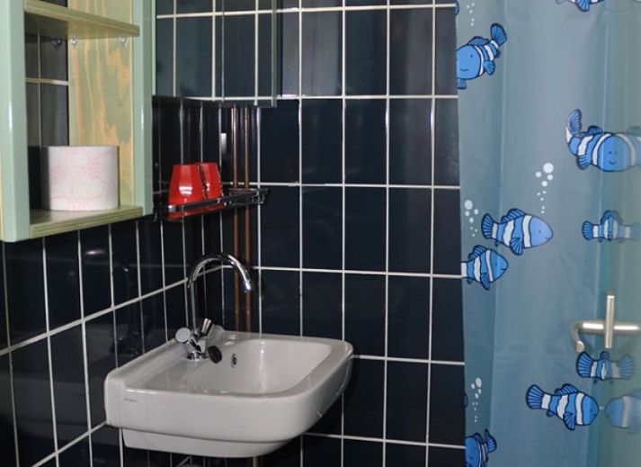 Gezellige woonkamer van Schanulleke, vakantiehuis in De Koog, Texel met comfortabele zitruimte en eethoek.