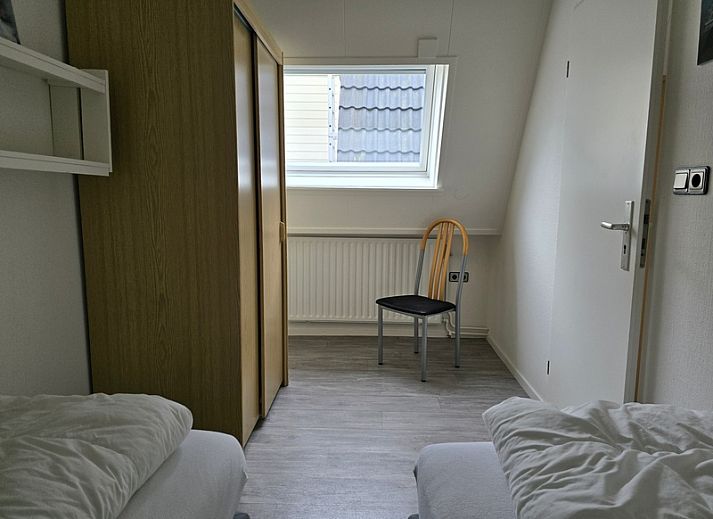 Uitzicht vanaf Appartementen Anna - Appartement 15 op de schilderachtige daken van De Koog, Texel.