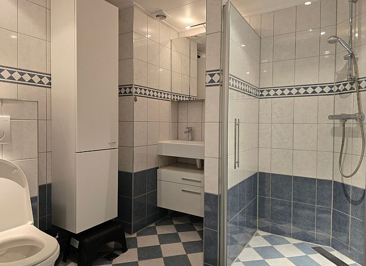 Uitzicht vanaf Appartementen Anna - Appartement 15 op de schilderachtige daken van De Koog, Texel.