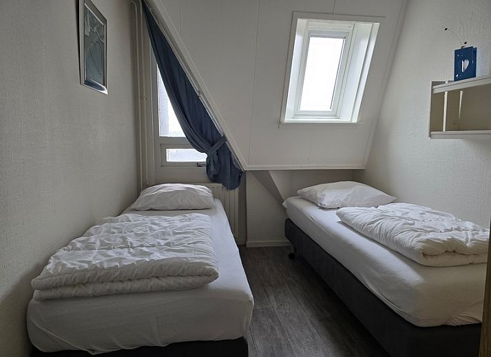 Uitzicht vanaf Appartementen Anna - Appartement 15 op de schilderachtige daken van De Koog, Texel.