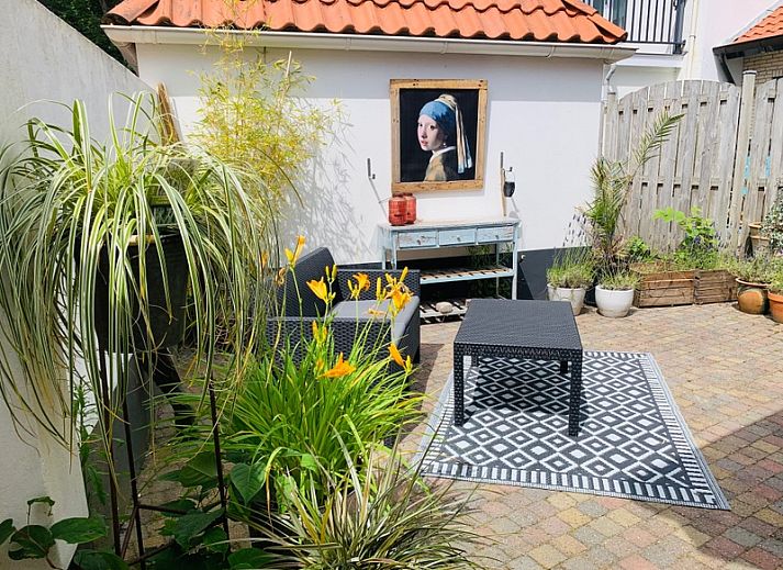 Gezellige tuin met zithoek bij vakantiehuis Texel D in De Koog, Texel, Waddeneilanden.