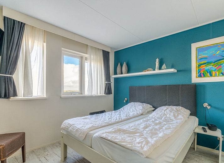 Stilvolle Sitzecke im Apartment Juliana 148 Island and Sea View, De Koog, Texel mit Blick auf die Watteninseln.