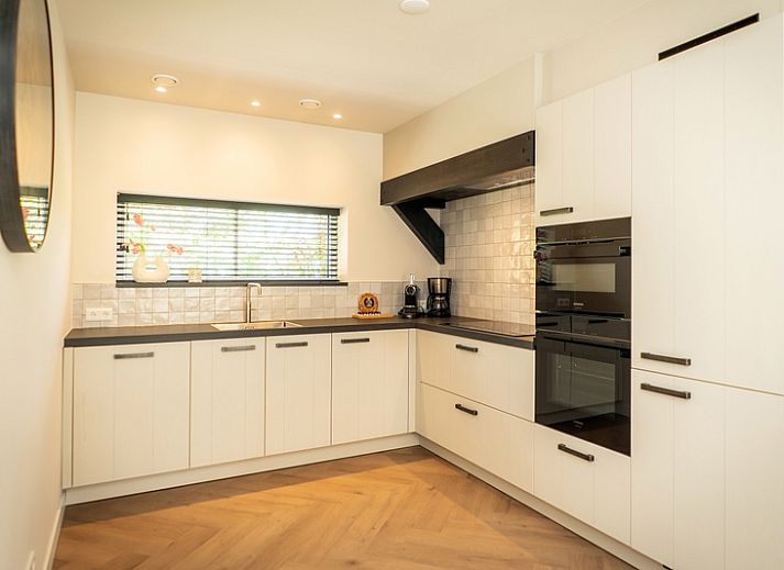 Vakantiehuis Villa 25a, De Koog, Texel met terras en groene omgeving op de Waddeneilanden.