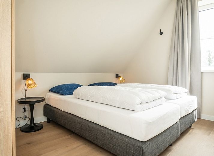 Villa 25a in De Koog, Texel met gezellige buitenruimte en terras op de Waddeneilanden.