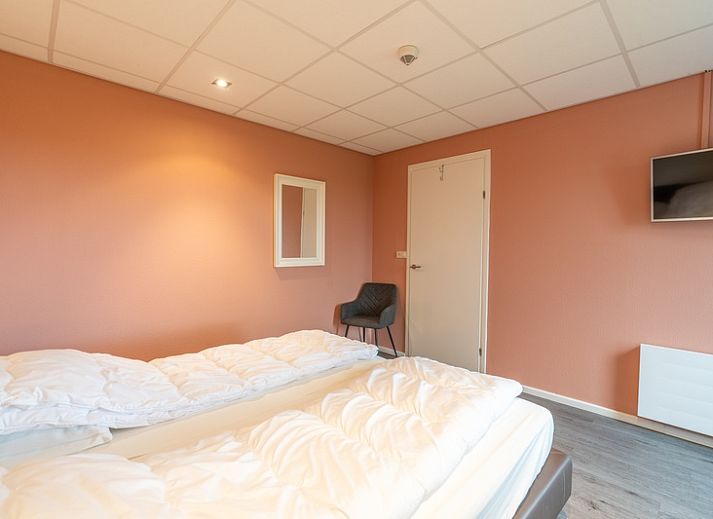 Einladende Sitzecke im Appartement Juliana 028 Zeezicht, De Koog, Texel mit Meerblick.