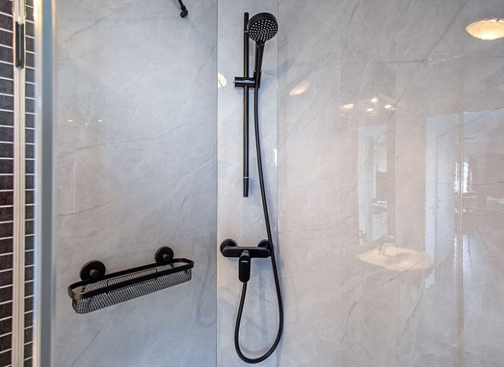 Gezellige woonkamer in Chalet Bregkoog 7, De Koog, Texel met comfortabele zitruimte.