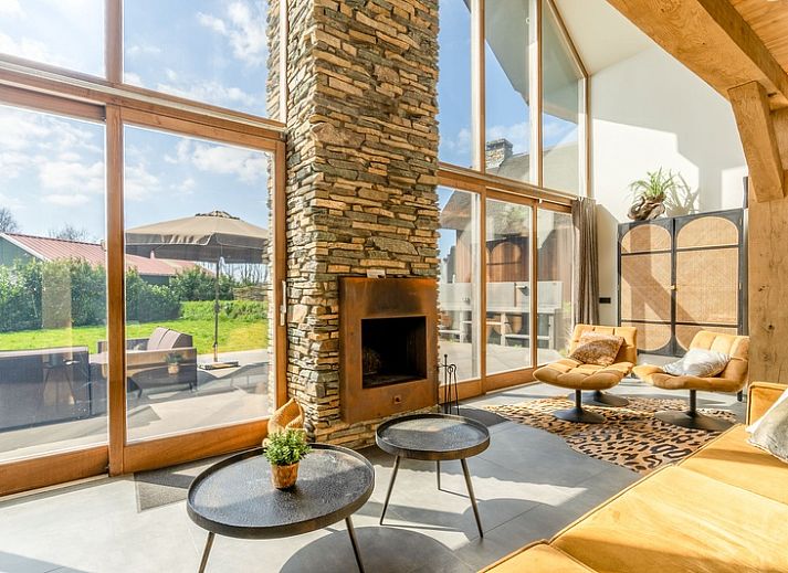 Villa 181 with Hot tub in De Koog, Texel offers a spacious terrace with modern seating area surrounded by nature on the Wadden Islands.