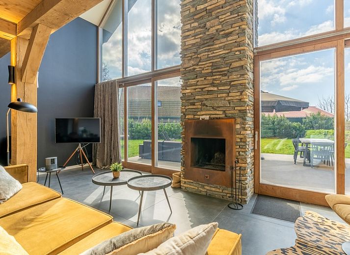 Villa 181 with Hot tub in De Koog, Texel offers a spacious terrace with modern seating area surrounded by nature on the Wadden Islands.