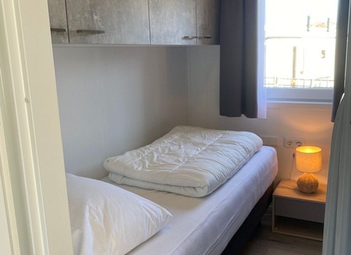 Chalet Bregkoog 94 auf Texel. Ferienhaus mit grossem Aussenbereich und Blick auf den Park in De Koog, Wadden Islands.