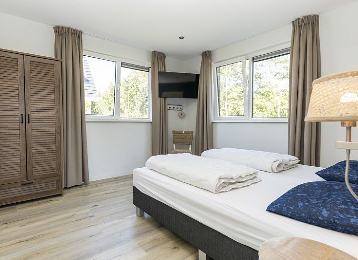 Villa 15 in De Koog, Texel met moderne architectuur en zonnige tuin, perfect voor een ontspannen vakantie op de Waddeneilanden.