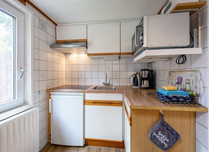 Gezellige tuin bij Karekiet in De Koog, Texel, ideaal voor ontspanning.