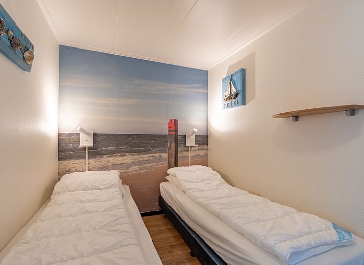 Gezellige zithoek in Appartement Anna 218, De Koog, Texel, met groene accenten en eetgedeelte.