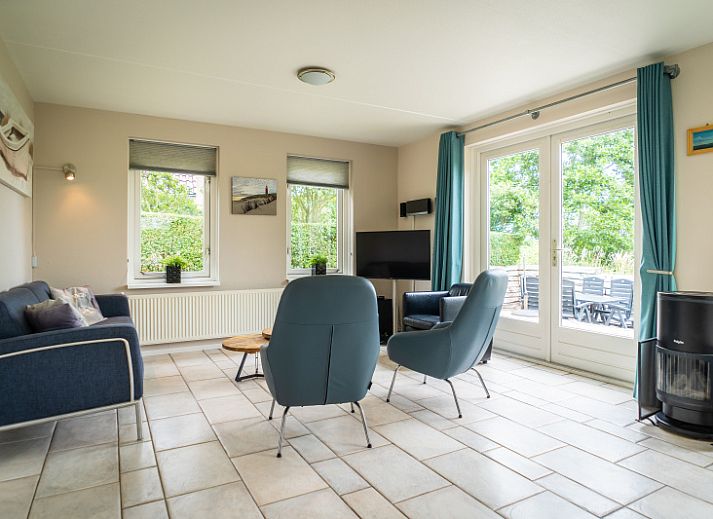 Villa 6 personen in De Koog Texel, vakantiehuis met zonnig terras en groene omgeving op de Waddeneilanden.