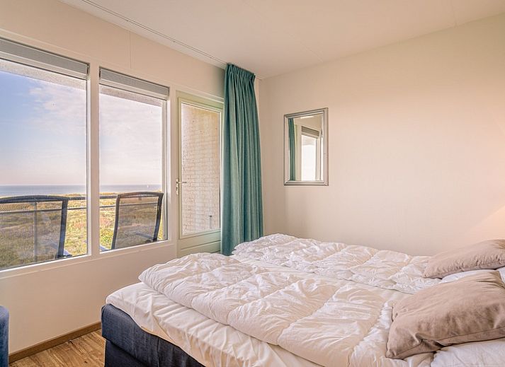 Moderne lounge met uitzicht op de kust in Appartement Juliana 102 Zeezicht, De Koog, Texel.